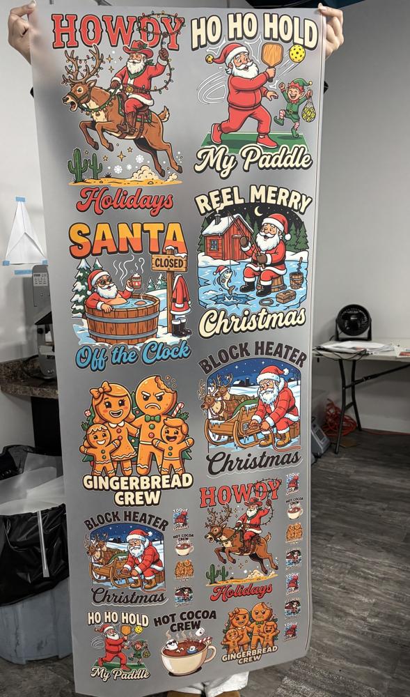 Real photo: printed Christmas Gang Sheet 2 (Howdy Holidays sheet) held up in the YSSDTF shop
