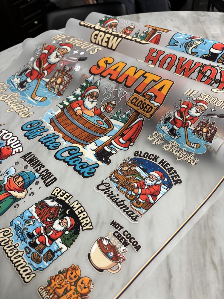 Real photo: close-up of printed Christmas DTF transfer rolls