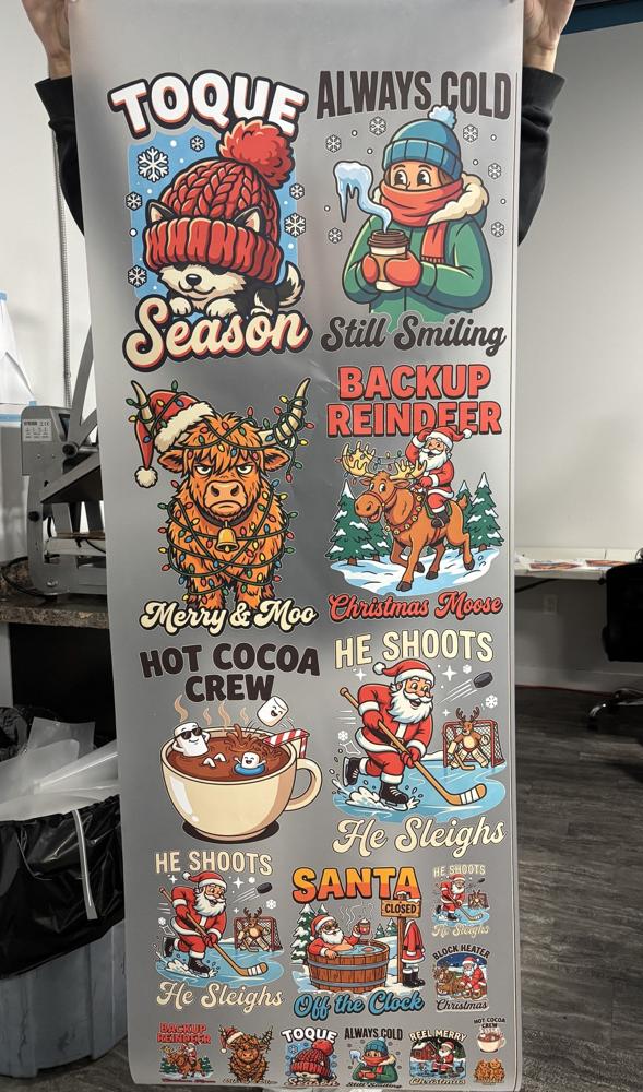 Real photo: printed Christmas Gang Sheet 1 (Toque Season sheet) held up in the YSSDTF shop
